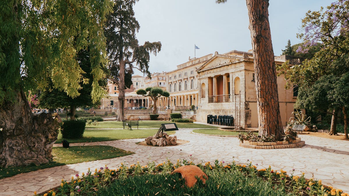 Beautiful palace garden with neoclassical statues and Mediterranean landscaping
